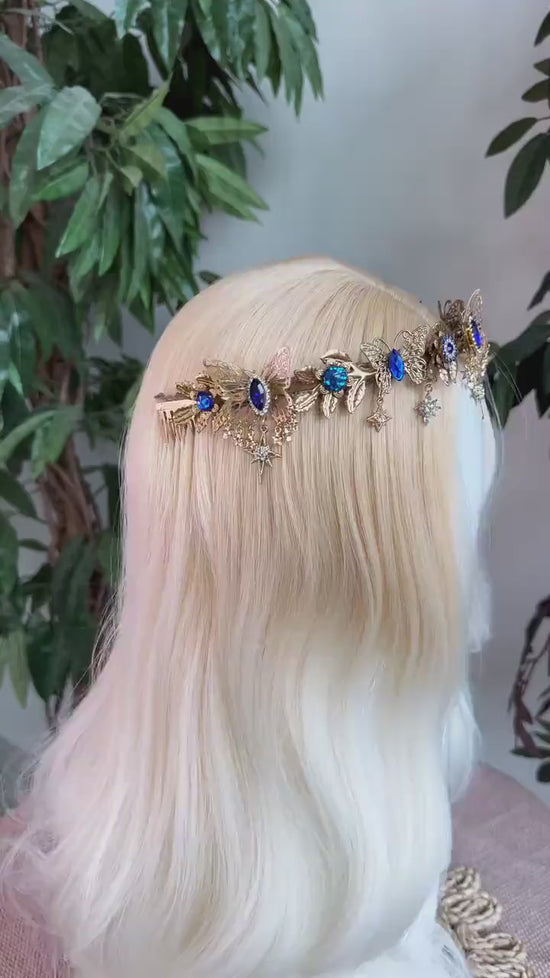 Load and play video in Gallery viewer, Butterfly Tiara, Gold Crown with Blue Crystals Stars, Bridal Headpiece for Weddings Festivals, Luxury Handmade Tiara for Special Occasions
